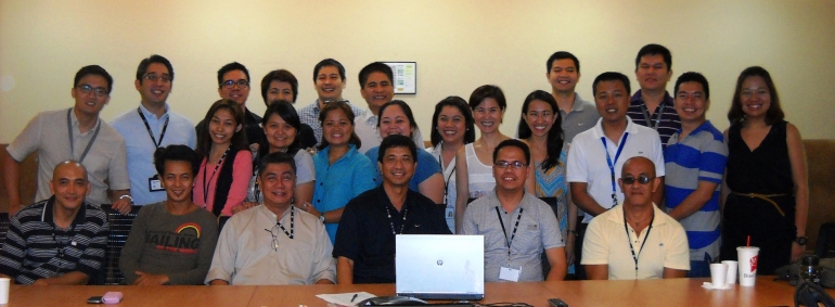 Seated from left: Homer Cipriano (Taguig CDO), Marlon Ganan (Taguig CDO), Luis Miranda (Head of Taguig CDO), Val Hilario, Mon Visey (GM of CCEECO), Rudy Contreras (Taguig CDO). Second row from left: Eugene Teves, Simon Villalon, Ruby Serdena (CCEECO), Sherry Rodulfo, Aloha Cruz, Gracie Jimenez, Pia Hamoy, Sal Mateo, Ela Mangubat, Jay Calma, Led Mangubat, Anna Mae Angeles.  Third row from left: Jody Salas, Bonna Suerte, Kookie dela Cruz, Dune Akiate, Roji Nulud, Mike Nicolas